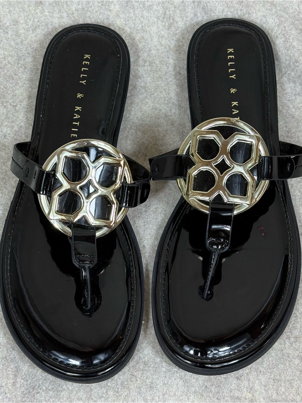 Kelly & Katie Black Patent Thong Sandals with Gold Honeycomb/Logo Emblem